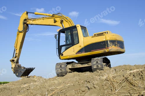 Preview: Construction Job Site: A Hydraulic Excavator Sits Atop A Hill Of Its Own Making