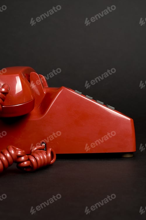 Preview: An Old Red Telephone With A Number Pad.