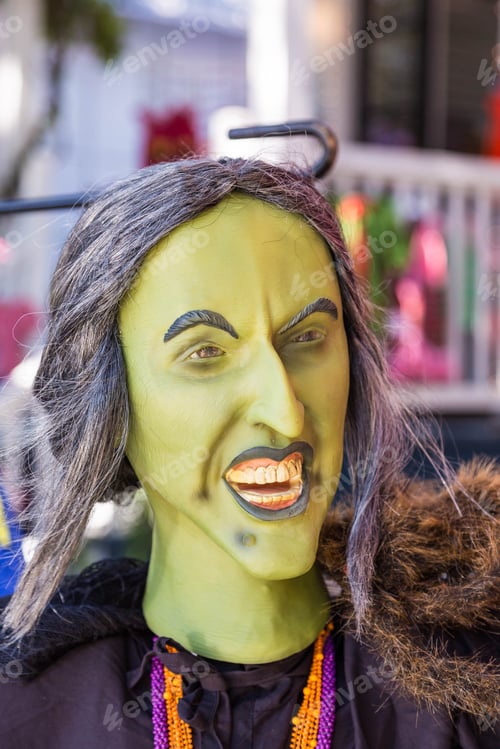 Preview: A Green Witch In An Outdoor Market At Halloween