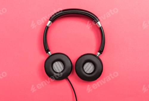 Preview: Headphones Pair Of Headphones On A Pink Paper Background