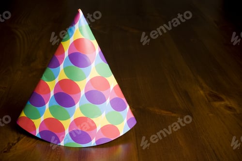 Preview: A Multicolored Party Hat Sitting On A Table.