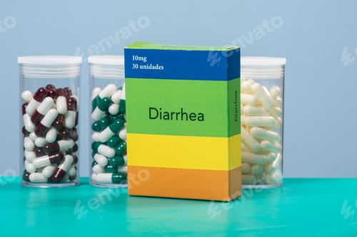 Preview: Colored Capsule Of Medication In Transparent Plastic Storage Container And Diarrhea Medicine Box