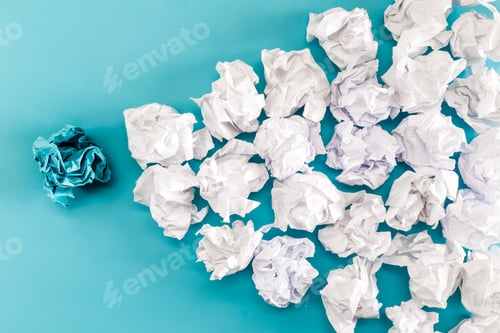 Preview: Crumpled Paper Balls On A Blue Background