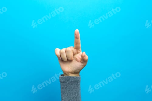 Preview: Person Pointing At Something On A Blue Background