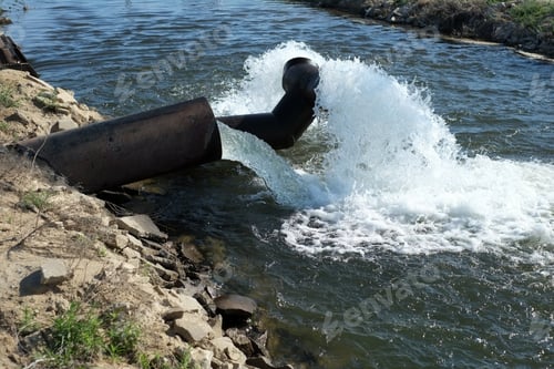 Preview: Water Gushes From Pipe Into Irrigation Canal On A California Farm