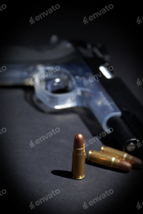 Preview: A Handgun And Selective Focus On The Upright Bullet.