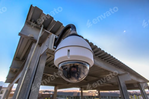 Preview: White Dome Security Camera In Business Lot