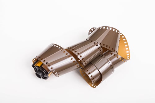 Vista previa: A Roll Of Old 35Mm Photographic Film On A White Background