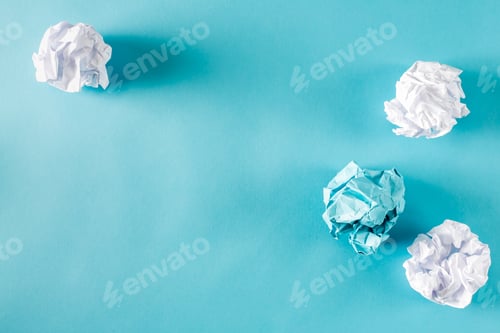 Preview: Crumpled Paper Balls On A Blue Background