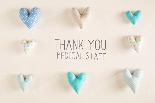 Preview: Thank You Medical Staff Message With Blue Heart Cushions On A White Paper Background