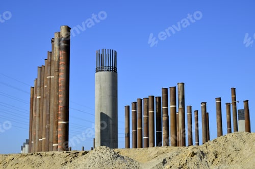 Preview: Bridge Construction Project: Concrete Columns Are Poured In Place. Vertical Steel Pipes Are Used To