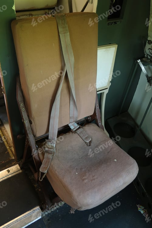 Preview: Old Fashioned Jump Seat On An Abandoned Airplane. Natural Light.