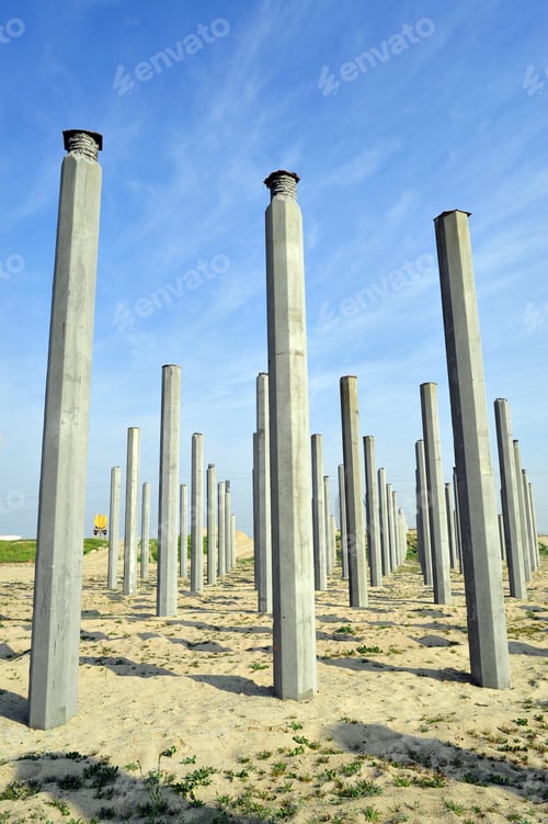 Preview: Multiple Pilings Sunk In River Bed Will Support New Bridge Under Construction