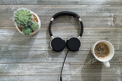 Preview: Headphones On A Wooden Desk Overhead View