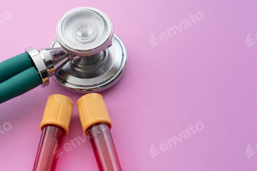 Preview: Stethoscope With A Vacuum Tube Full Of Blood On A Lilac Background.