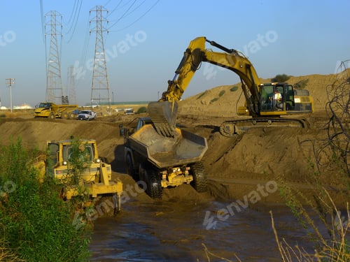 Preview: Water Is Diverted While Construction Equipment Is Used To Widen And Deepen A River Bed