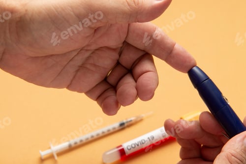 Preview: Person Doing Fingertip Test For Blood Glucose, With Vacuum Tube For Blood Testing Of Test Blood