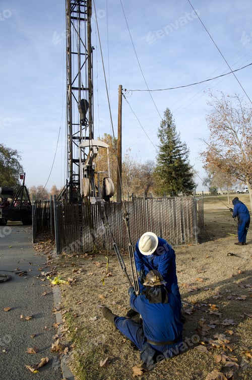 Preview: Workers Tighten Guy Wires On Oil Well Servicing Rig