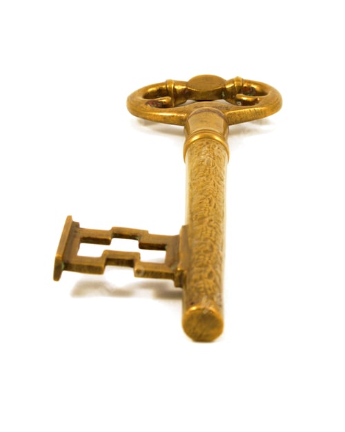 Preview: An Isolated Over White Image Of A Large Brass Key.