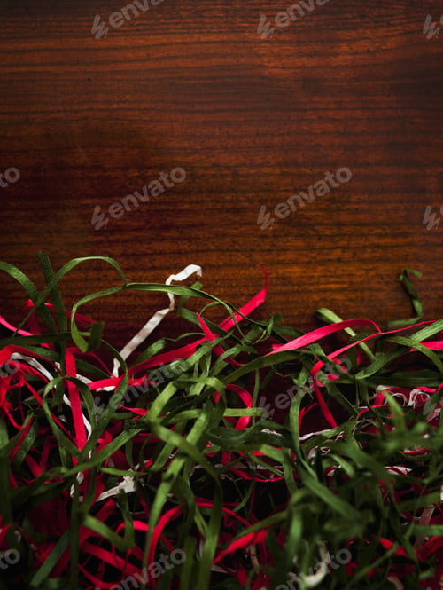 Preview: A Pile Of Red, White And Green Ribbons On The Floor.