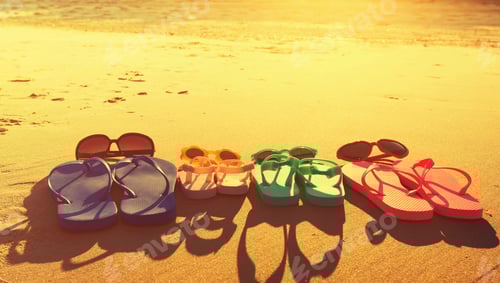 Preview: Colorful Sandals On The Sand At The Beach
