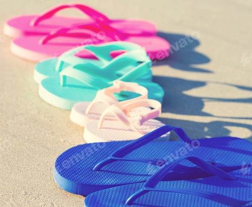 Preview: Colorful Sandals On The Sand At The Beach
