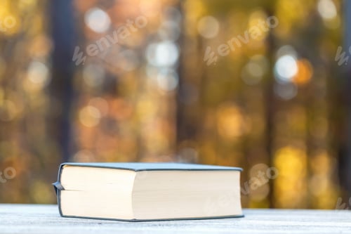 Preview: Big Hardcover Book On A Fall Forest Background