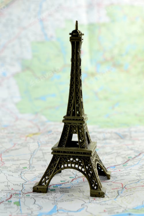 Preview: Closeup View Of A Miniature Eiffel Tower Ontop Of A Map For Travel Concepts.