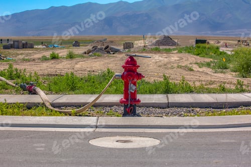 Preview: Wrench And Hose Connected To Hydrant