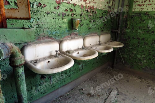 Preview: Row Of Sinks Inside An Abandoned, Neglected Building.