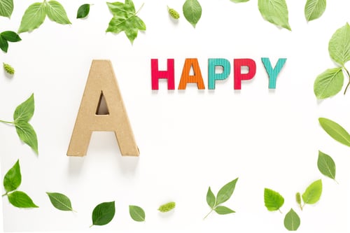 Preview: Letter A And Happy With Green Leaves
