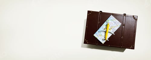 Preview: Travel Theme With A Miniature Airplane And A Suitcase - Flat Lay