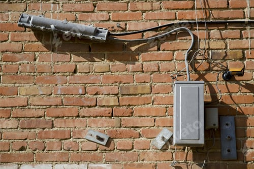 Preview: Old Abandoned Telephone Apparatus Is Still Fixed To Building'S Brick Wall