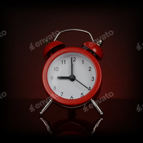 Preview: A Closeup View Of A Vibrant Red Desk Alarm Clock.