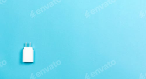 Preview: Charger Plug Adapter On A Blue Paper Background