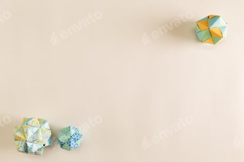 Preview: Overhead View Of Origami Balls On A White Desk