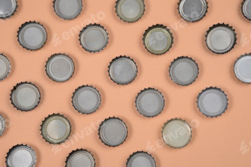 Preview: Bottle Caps Lined Up In Color Background.