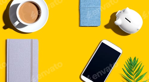 Preview: Smartphone With A Piggy Bank And Notebooks - Flat Lay