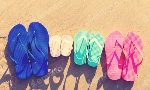 Preview: Colorful Sandals On The Sand At The Beach