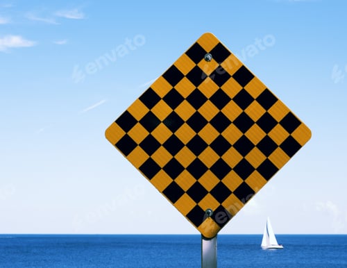 Preview: A Sign Close To The Sea With A Yacht Sailing Behind.