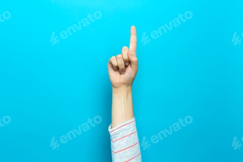 Preview: Person Pointing At Something On A Blue Background