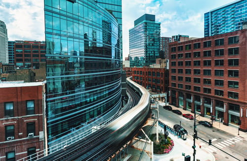 Preview: An Elevated Train Curving Through Downtown Chicago