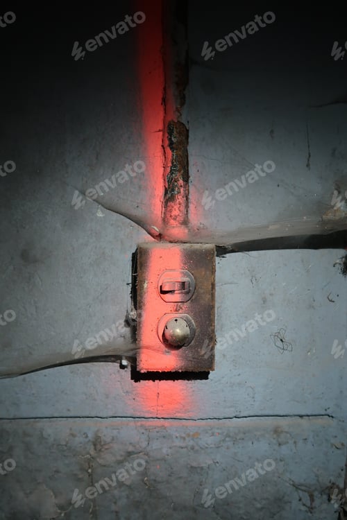 Preview: Painted Light Switch With Cobwebs On It. Lit By Flashlight. Dark Vignetting.