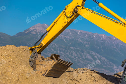 Preview: Yellow Tractor Seen In Front Of Mountains