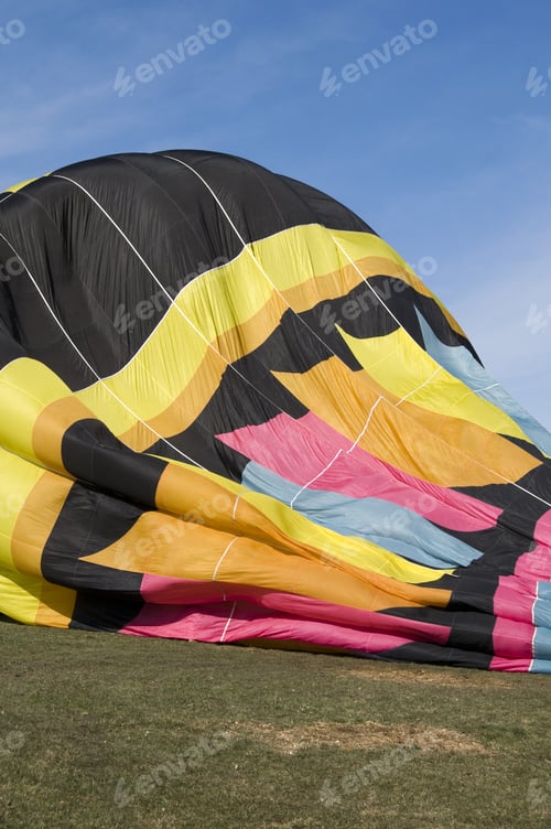 Preview: A Hot Air Balloon Deflating On The Ground.