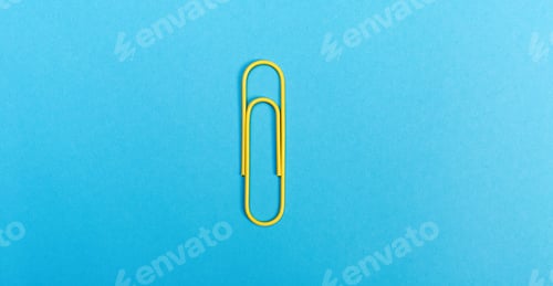 Preview: Big Paper Clip On A Bright Blue Background