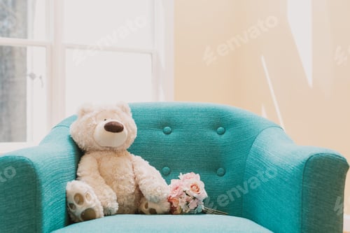 Preview: Teddy Bear And A Flower Bouquet On A Chair In A Room