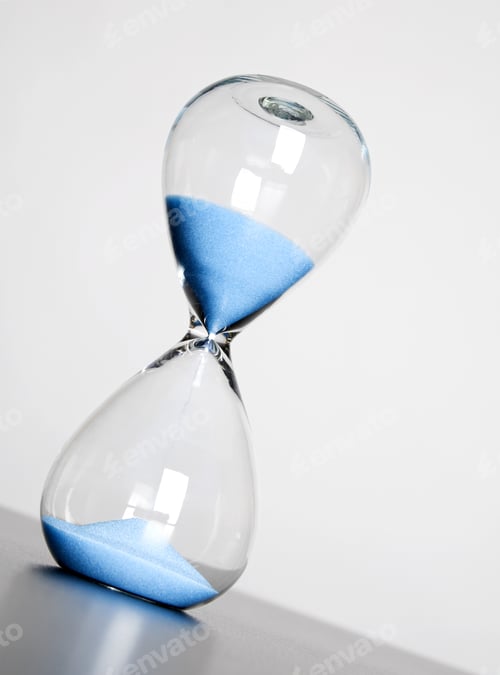 Preview: A Close-Up Of Sand Flowing Through An Hourglass.