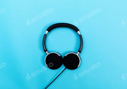 Preview: Pair Of Black Headphones On A Blue Background