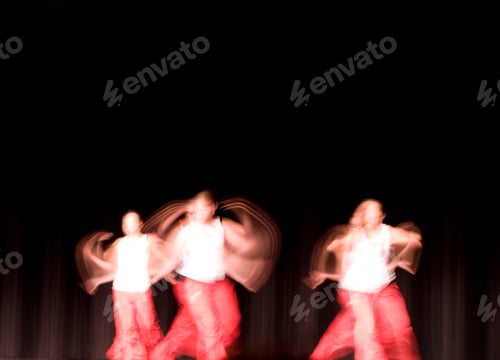 Preview: A Group Of Dancers Performing On A Stage.